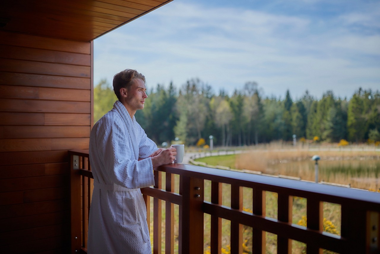 man on the apartment balcony